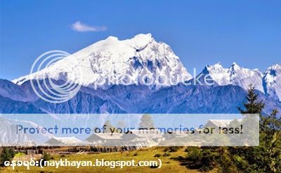 http://i1183.photobucket.com/albums/x474/konay1/general%206/A-beautiful-scene-of-residences-seen-with-snow-capped-mountains-in-the-background-of-Khakaborazi-National-Park..jpg